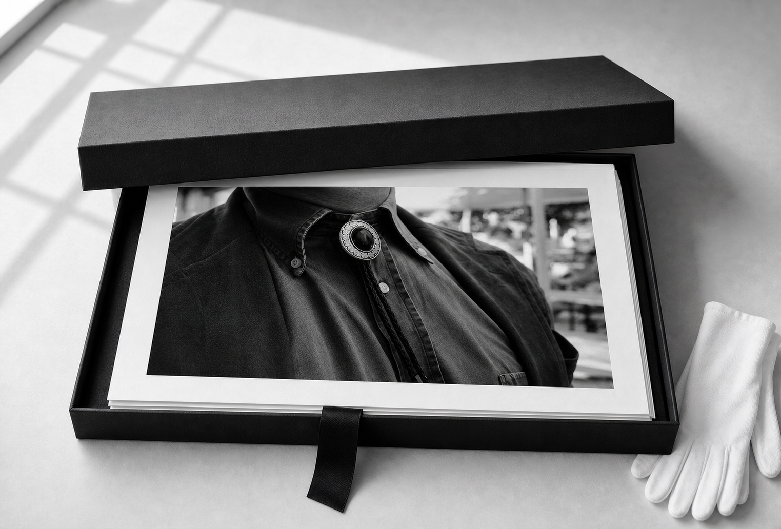 Portfolio box with black-and-white giclee prints.