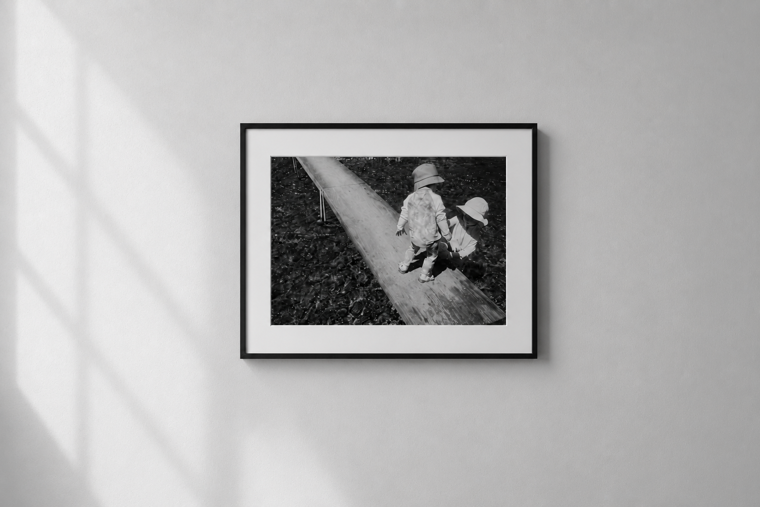 Framed black-and-white giclee print installed on a gallery wall.