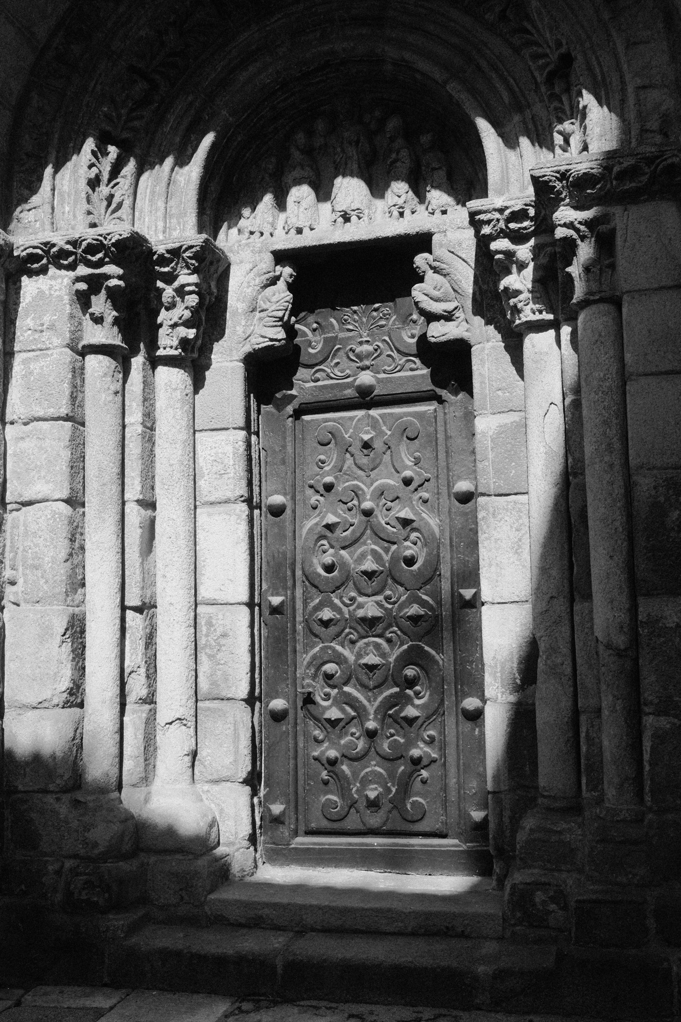 Black-and-white photograph of an arched church doorway from Seeking Grace.