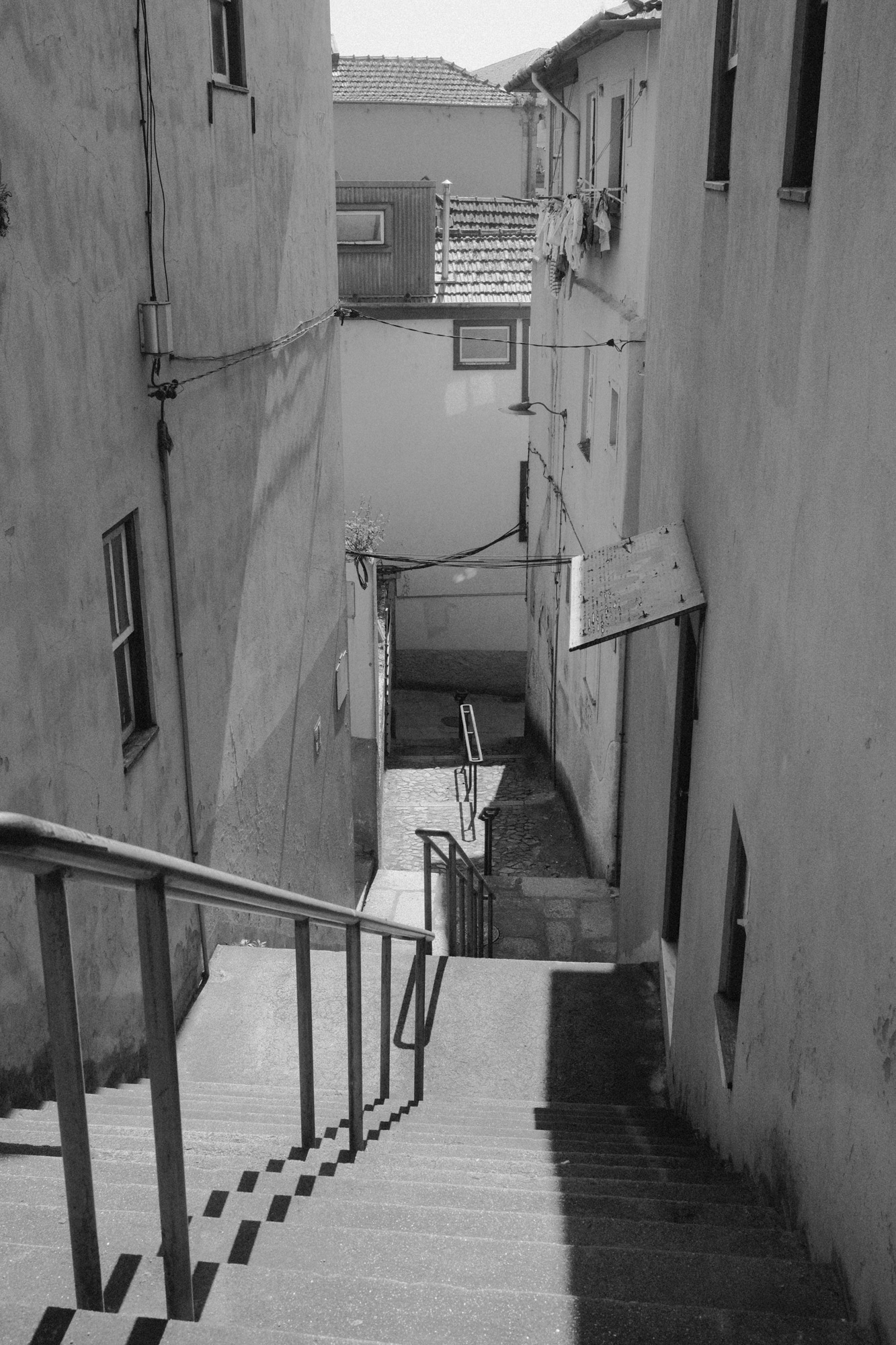 Black-and-white photograph of narrow stairs and walls from Seeking Grace.