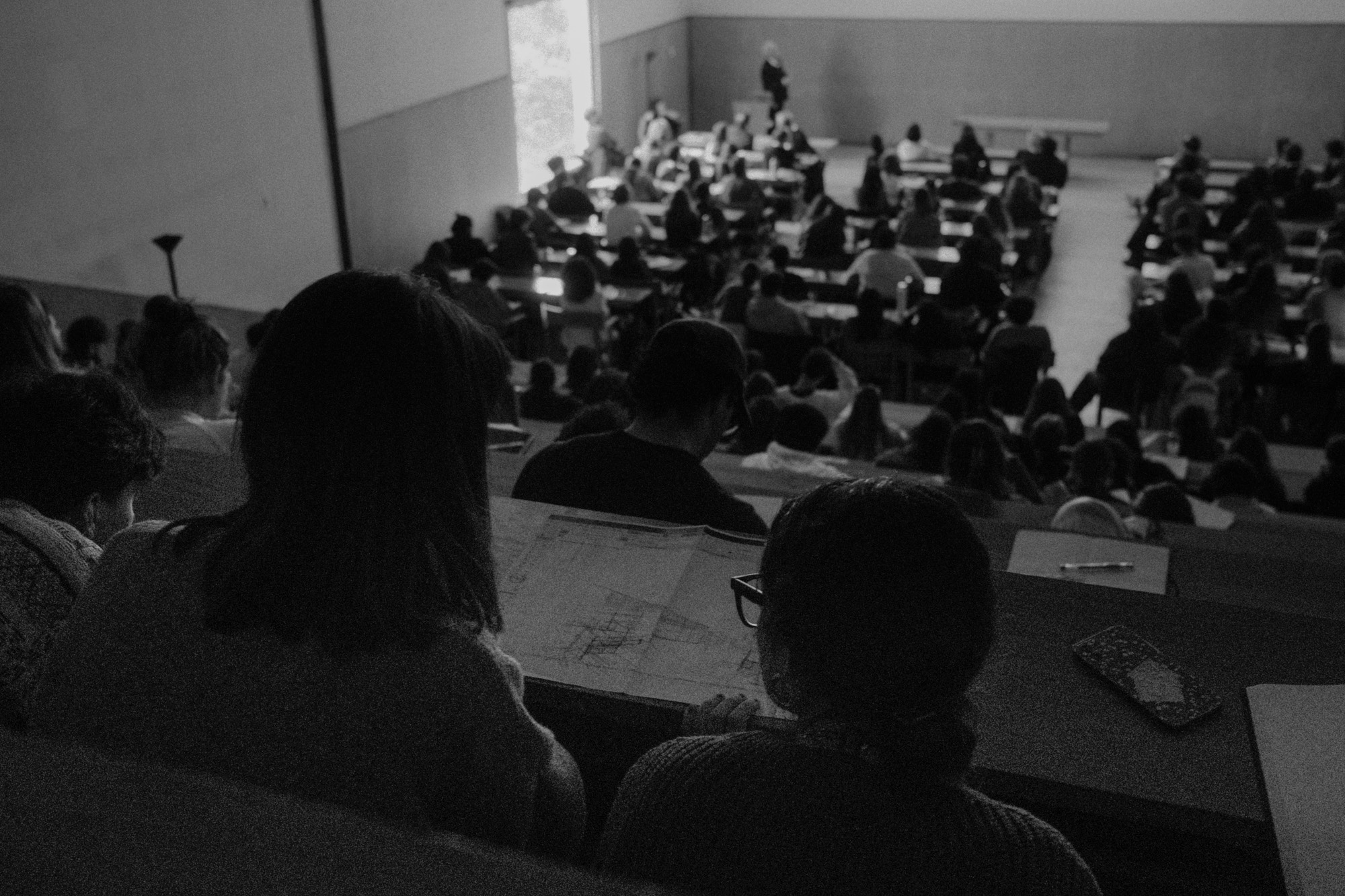 Black-and-white documentary photograph of a music education concert.