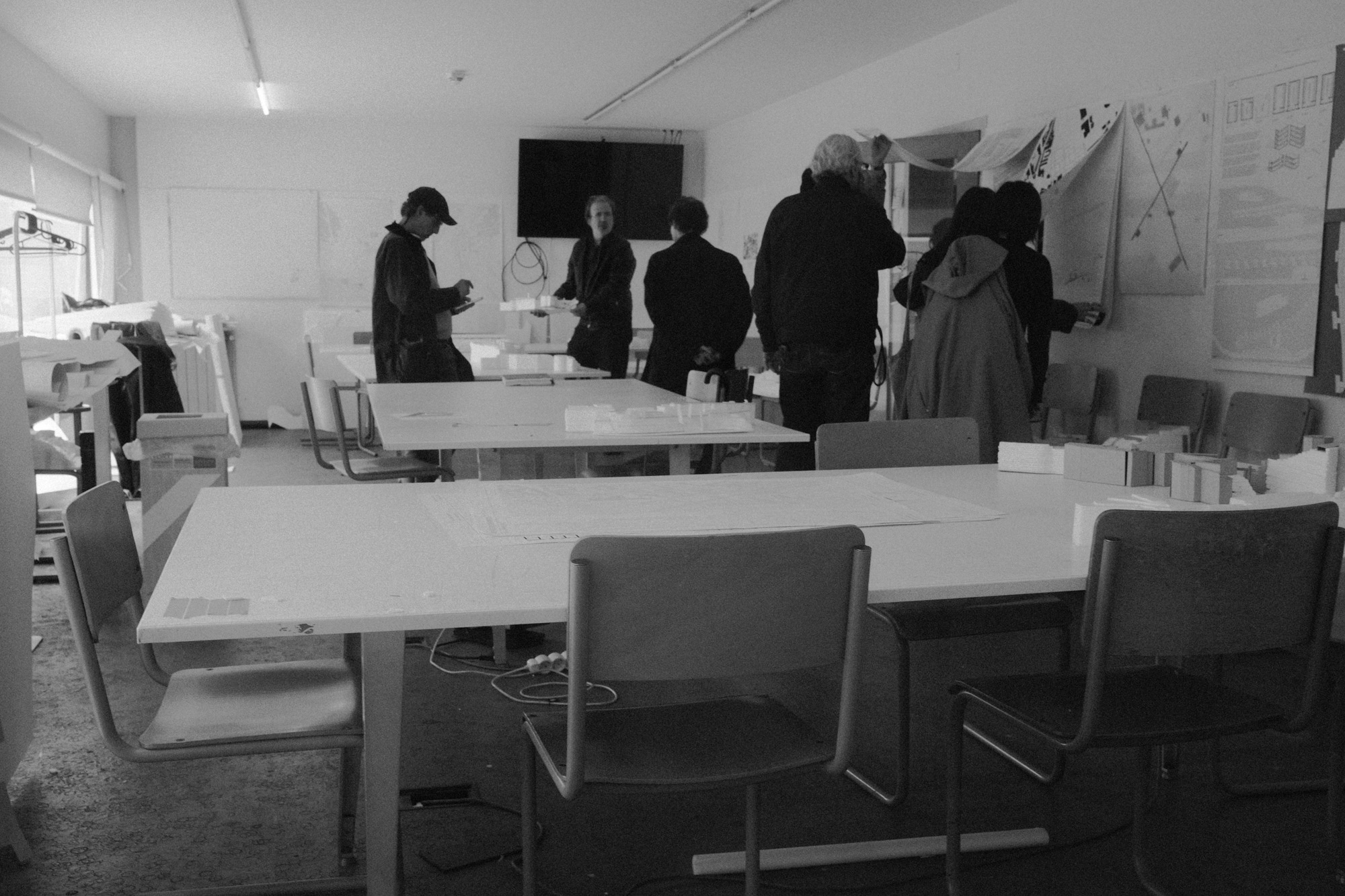 Black-and-white documentary photograph of a classroom workshop for a cultural program.